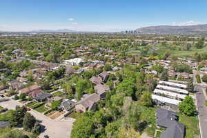 Birds eye view of property with a mountain view and a residential view