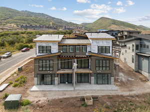 Rear view of property with a mountain view