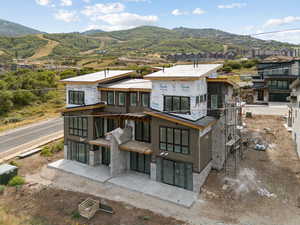 Back of property with a mountain view