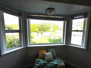 Natural light coming in bay window in main bedroom.