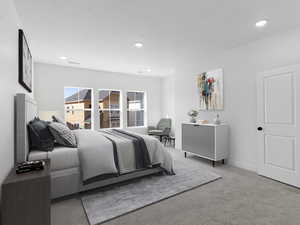 Carpeted bedroom featuring baseboards, visible vents, and recessed lighting