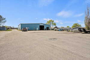 Exterior space featuring a pole building and a garage