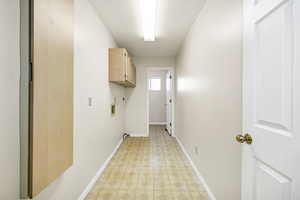 Interior space featuring light floors and baseboards
