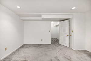 Finished basement featuring baseboards, carpet flooring, and recessed lighting