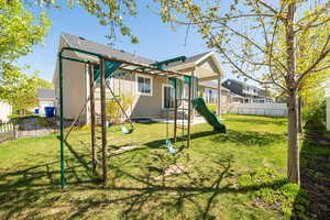 Exterior space with fence and a yard