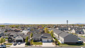 Drone / aerial view featuring a mountain view and a residential view