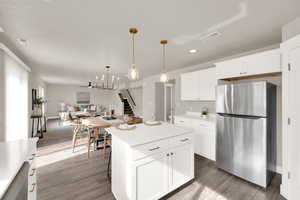 Beautiful Kitchen with open floor plan, and a kitchen island.