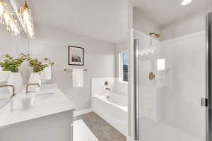 Beautiful Primary Bathroom featuring a garden tub, brass accents and hardware and a separate shower!