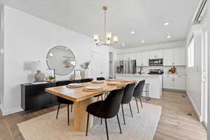 Spacious dining space with large furniture and built-in buffet cabinet. Sliding doors to the backyard