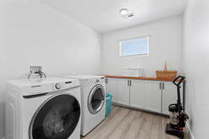 Laundry room with cabinet space with folding area and storage area