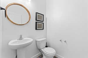 Half bath between the office and living room
