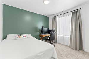 Spacious bedroom fitting a queen bed and desk