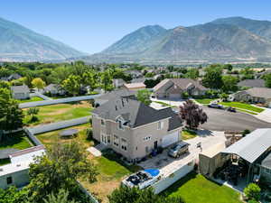 Birds eye view of property with a mountain view and a residential view