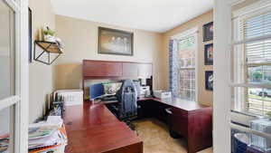 Office area featuring light carpet