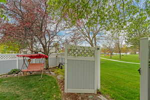 View of yard with a gate and fence private yard