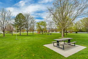 View of community with playground community and a yard