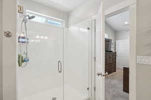 Full bath with vanity and a shower stall