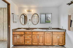 Full bathroom with double vanity and a sink