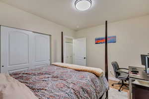 Bedroom #5  featuring baseboards, light wood-style floors, and a closet