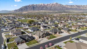 Birds eye view of property with a mountain view and a residential view