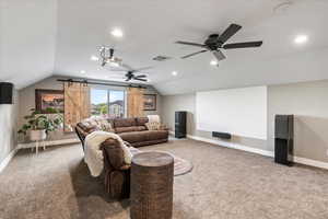 Bonus room with lofted ceiling, baseboards, and included projector