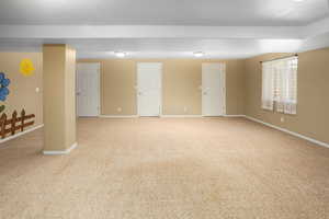 Basement with carpet floors and baseboards