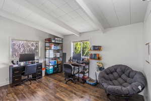 Home office featuring beamed ceiling and dark wood finished floors