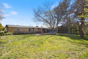 View of yard featuring fence