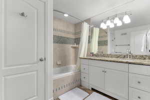 Basement Bathroom with oversized vanity and linen closet.