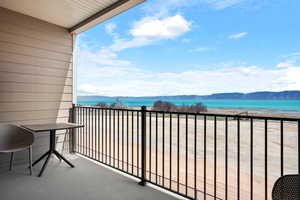 Balcony featuring a Bear Lake and mountain view