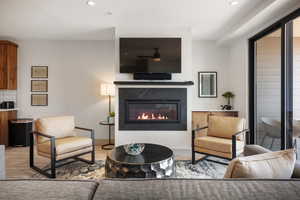 Cozy up to the fireplace in this comfortable living space, while enjoying the Bear Lake view