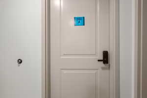 Door A to  main living space from shared entrance of 302
