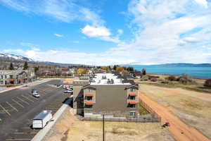View of building exterior with uncovered parking