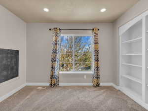 Interior space featuring baseboards, carpet floors, and recessed lighting