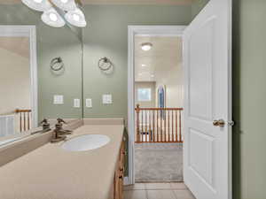 Bathroom featuring vanity, tile patterned floors, and visible vents