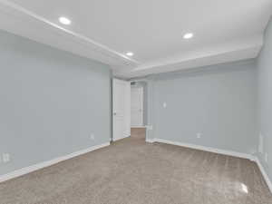 Interior space with recessed lighting, carpet flooring, and baseboards