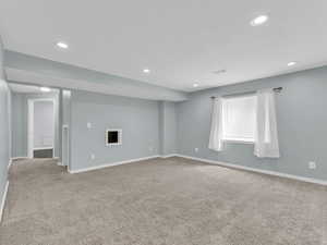 Interior space with visible vents, baseboards, and recessed lighting