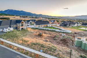 Birds eye view of property with a mountain view and a residential view