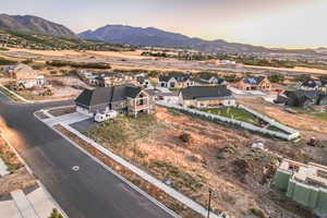 Aerial view at dusk featuring a mountain view and a residential view