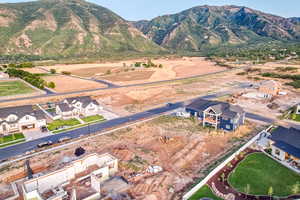 Birds eye view of property with a mountain view and a residential view