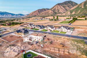 Birds eye view of property with a residential view and a mountain view
