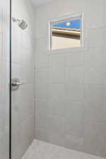 Bathroom with tiled shower