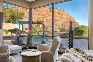 Sunroom / solarium featuring a healthy amount of sunlight and a mountain view