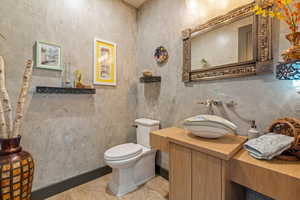 Bathroom featuring toilet and vanity