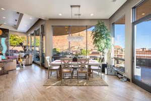 Dining space featuring recessed lighting, visible vents, and hardwood / wood-style flooring