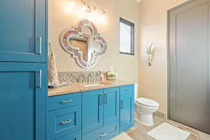 Bathroom featuring toilet and vanity