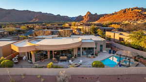 Back of property with a patio area, a fenced backyard, and a mountain view