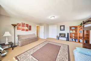 Living area with carpet floors and baseboards
