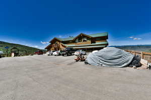 Uncovered parking lot featuring a mountain view