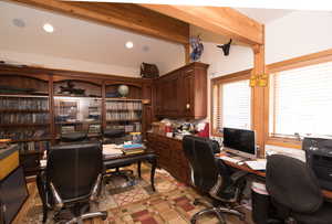 Home office with beam ceiling
